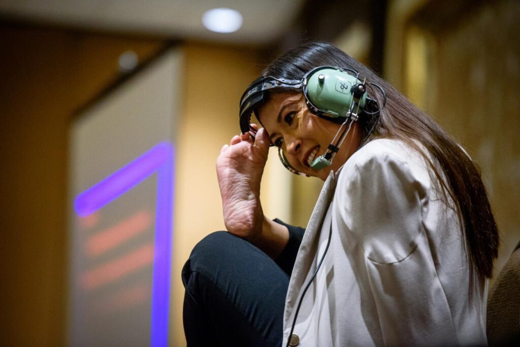 Jessica Cox putting on headset with foot